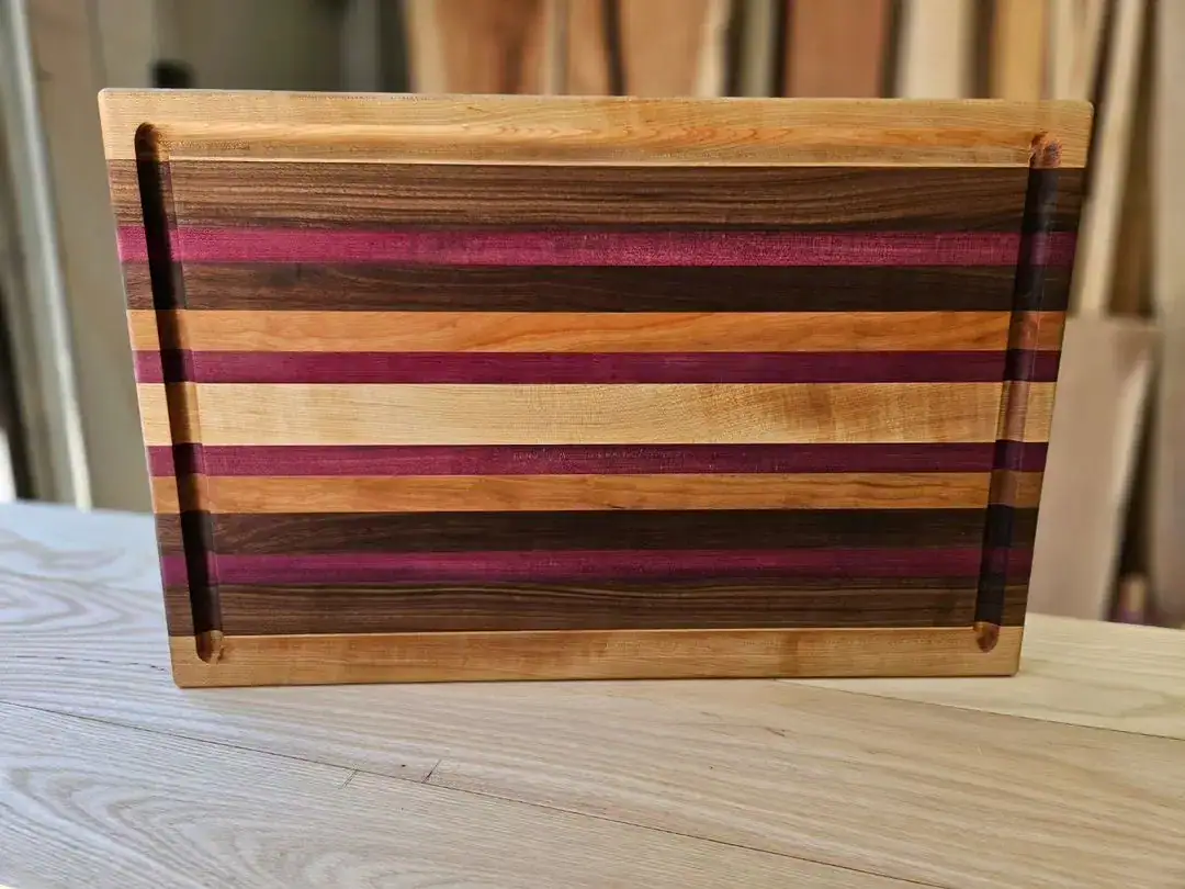 a burly boards cutting board custom made with a variety of different types of wood a burly boards cutting board custom made with a variety of different types of wood