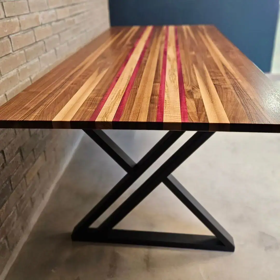 table with book matched strips of walnut with accents of purpleheart and ambrosia maple. table with book matched strips of walnut with accents of purpleheart and ambrosia maple.